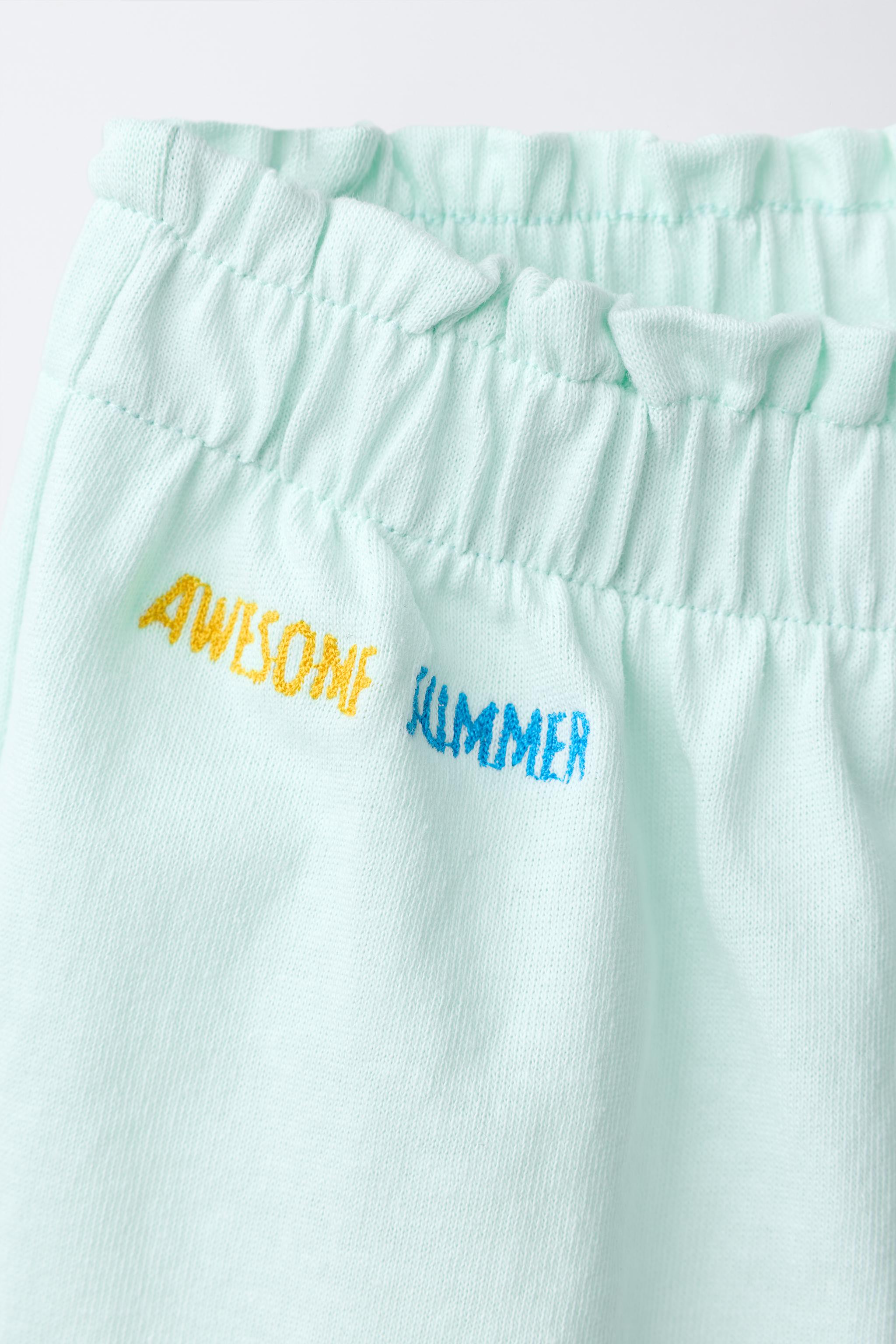 TROPICAL PRINT RUFFLE HEM SHORTS